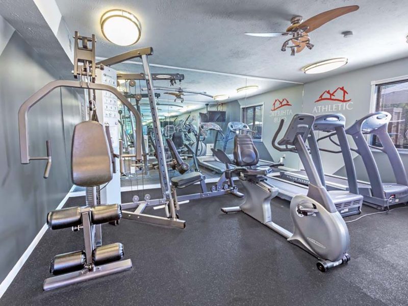 This image showcase the commercial fitness with State-of-the-art 2-level athletic club with fitness equipment that is essential for community amenities, and offering indoor cycle.