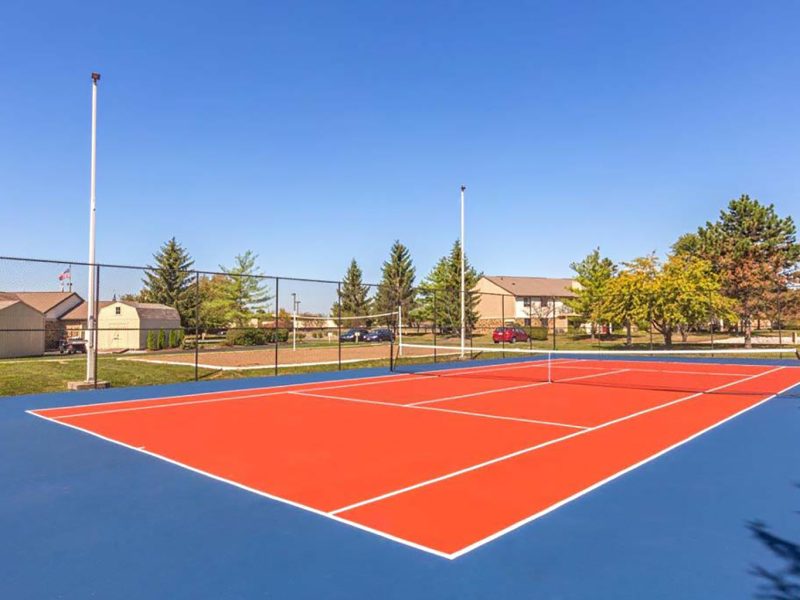 This image shows the premium community amenities, particularly the lighted tennis court with courtesy tennis balls that were ideal for a family and colleagues to enjoy.